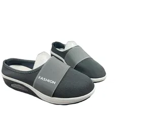 Detailed view of grey mesh mules with breathable platform wedge sole and elastic strap