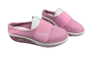 Detailed view of pink wedge heel clogs featuring breathable mesh and FASHION elastic strap