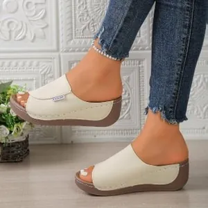 Side view detail of off-white peep-toe wedge platform rocker sandals on model's feet