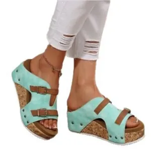 Stylish women's light blue wedge sandals with cork platform sole and studded straps