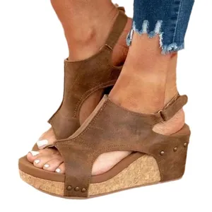 Stylish brown women's platform wedge sandals with peep toe and rivet stud details