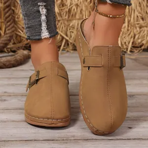 Women's stylish tan wedge closed-toe mules with buckle strap and contrast stitching