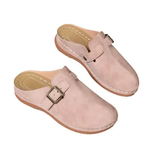 Stylish women's closed-toe mule sandals with wedge heel in dusty rose pink.