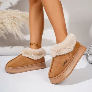 Close-up of tan faux fur lined platform slippers for women with SPORT embroidery detail