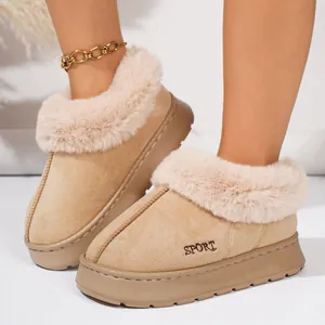 Detail view of warm beige platform slippers with faux fur trim and SPORT embroidery