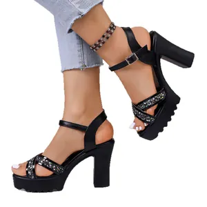 Black chunky heel platform sandals featuring sparkling rhinestone straps and ankle buckle
