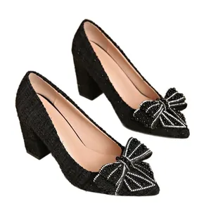 Elegant black tweed block heel pumps with pearl bow detail and pointed toe