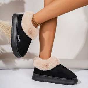 Cozy black winter plush slippers with thick faux fur lining shown worn with an anklet