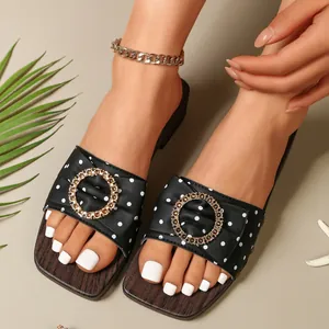Stylish retro polka dot slide sandals with gold buckle and wood grain platform sole