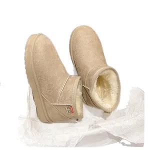 Cozy warm beige snow boots with faux fur lining and flat anti-slip sole for winter