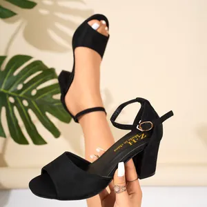 Elegant black peep-toe sandals with chunky heels and adjustable ankle strap for stylish women.