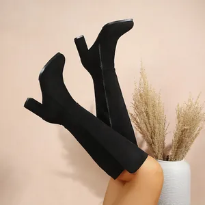 Elegant black suede knee-high boots with chunky block heel and convenient side zipper