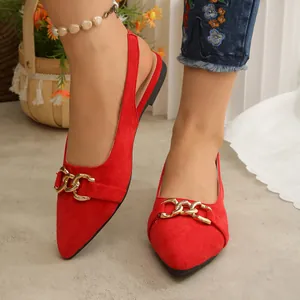 Elegant red pointed-toe flat slingback sandals featuring a decorative gold chain buckle.