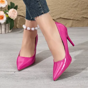 Close-up view of vibrant fuchsia patent leather pointed-toe stiletto high heels
