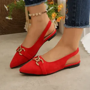 Red pointed-toe slingback flats with elegant gold chain buckle detail.