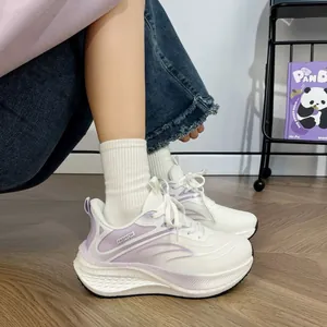 Detailed side view of white and purple platform sneakers featuring breathable mesh fabric
