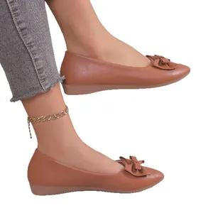 Elegant brown pointed-toe ballet flats for women featuring a stylish bow detail