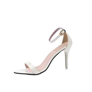 Elegant white high-heeled sandals with ankle strap and gold buckle stiletto