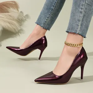 Dark purple patent leather pointed-toe stiletto pumps with gold chain anklet detail