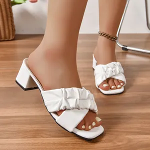 Detailed view of elegant white ruched straps on chunky heel slides for women summer