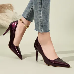 Detailed view of elegant burgundy patent leather pointed-toe stiletto high heels for women
