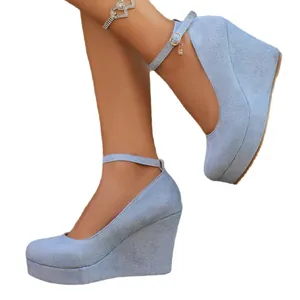Elegant light blue suede platform wedge heels with ankle strap for stylish women.