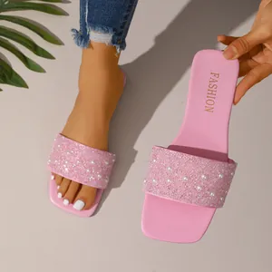 Stylish pink square toe slide sandals decorated with pearls and glittering rhinestones