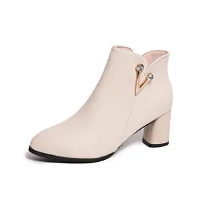 Elegant cream chunky heel ankle boot with sparkling rhinestone V-shaped hardware