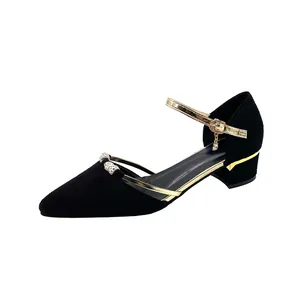 Elegant black pointed-toe Mary Jane shoes with gold rhinestone straps and stable block heels.