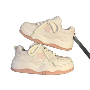 Women's chunky platform white sneakers with pink star pattern and thick rope laces