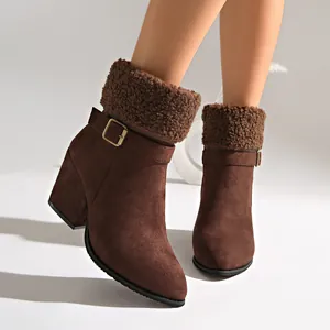 Detail view of brown suede ankle boots with plush cuff and chunky heel