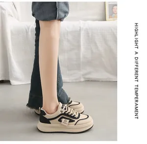 Detail side view of stylish Korean style cream platform sneakers with black accents for women