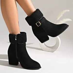 Black suede ankle boots featuring plush fold-over collar, metal buckle, and block heel