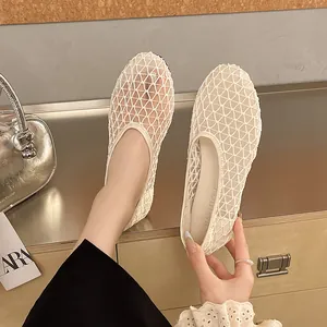 Detail view of stylish cream mesh flat shoes with breathable lattice pattern for women