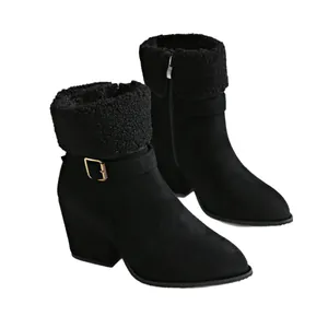 Black plush fold-over ankle boots with matte finish, buckle, and chunky heel