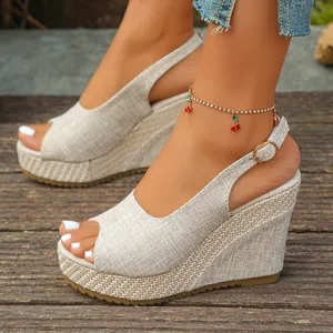 Close-up of linen texture peep-toe wedge sandals with stylish platform sole