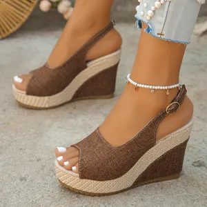 Stylish brown peep-toe wedge sandals with woven platform and adjustable ankle buckle strap