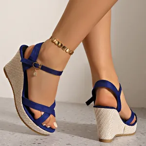 Women's blue suede wedge sandals with woven platform heel and buckle strap