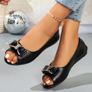 Elegant black peep-toe flat shoes with a sparkling rhinestone bow detail for women