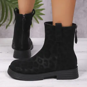 Detailed view of black leopard print ankle boots with back zipper and chunky sole