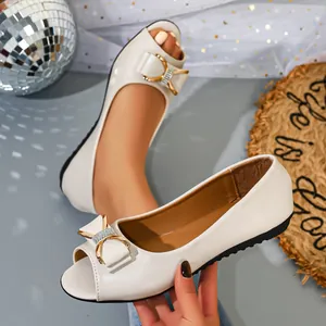 Detail of white peep-toe flat shoes with decorative bow buckle in French style