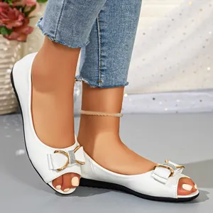 Elegant white open-toe flat sandals with decorative bow and rhinestone buckle