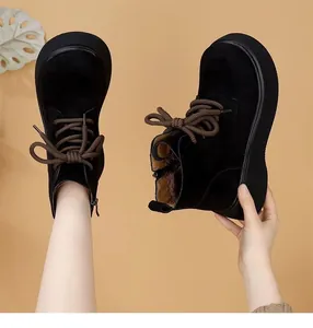 Black suede winter platform Martin boots with warm brown laces and plush lining