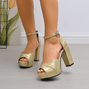 Champagne metallic gold platform sandals featuring chunky high heels and peep toe design
