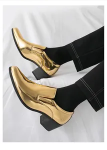 Side profile detail of shiny gold metallic slip-on dress shoes with a Cuban heel