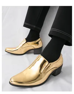 Close-up of shiny gold glossy round-toe men's dress shoes with Cuban heels