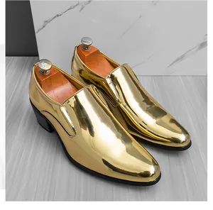 Detail view of glossy gold metallic loafers for men with Cuban heels and round toe design