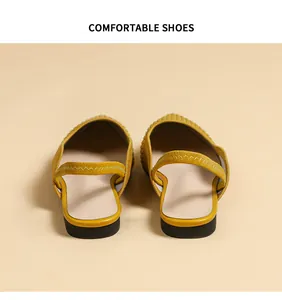 Rear view of yellow knit pointed slingback flats showing heel strap detail.