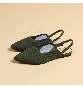 Close-up of knit texture and slingback design of olive green pointed-toe flat sandals.