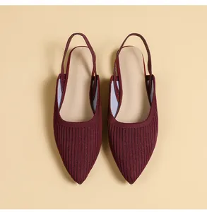 Detailed top view showing the texture of burgundy knitted pointed-toe flat slingback sandals
